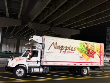 White refrigerated foodservice distribution truck with Nappies Food Service branding, showcasing bulk food logistics and cold chain supply operations.